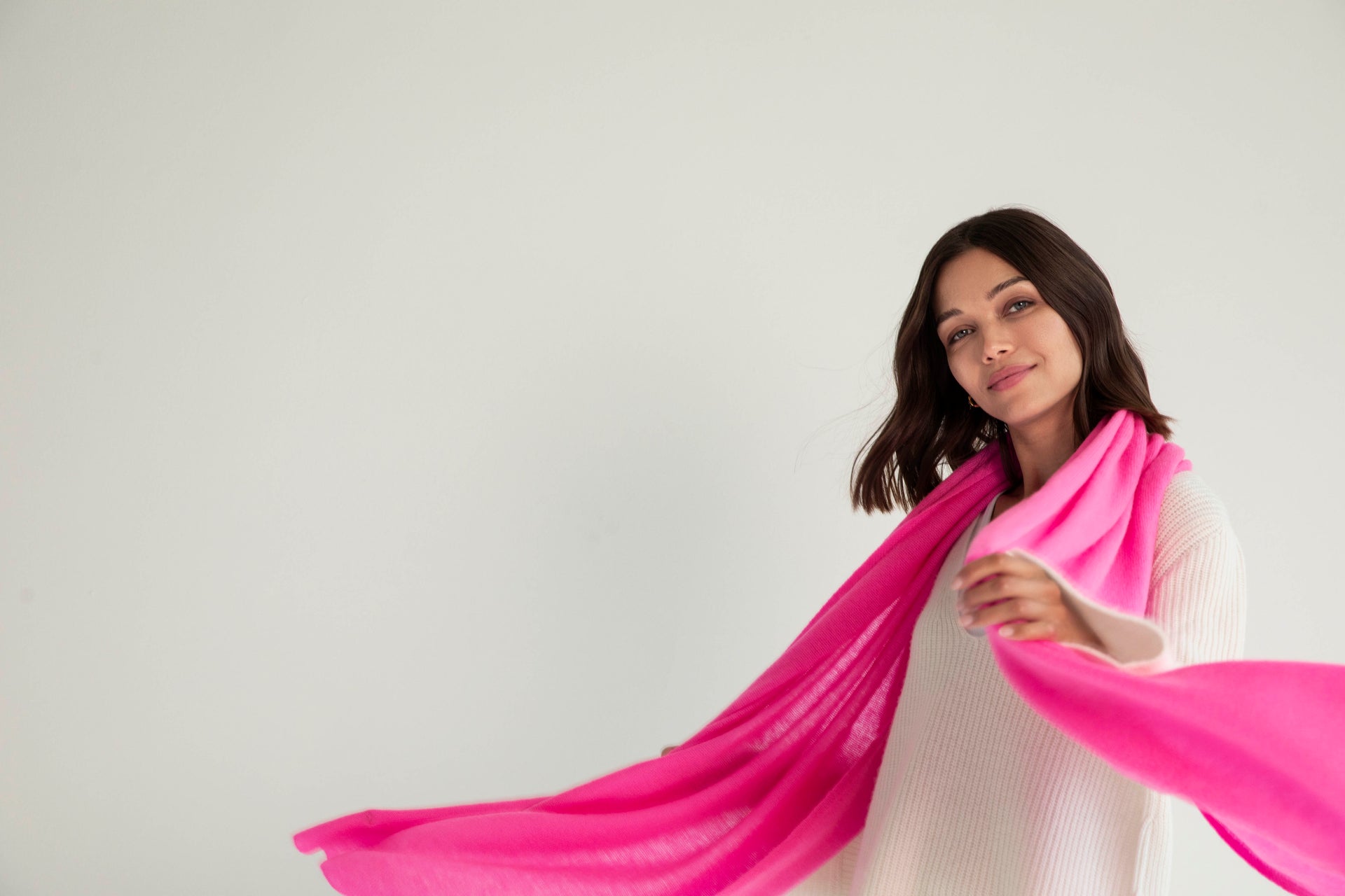 The Cashmere Travel Wrap in Neon Pink